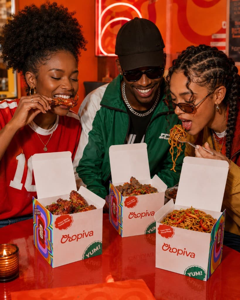 Friends sharing Chopiva boxes at the table